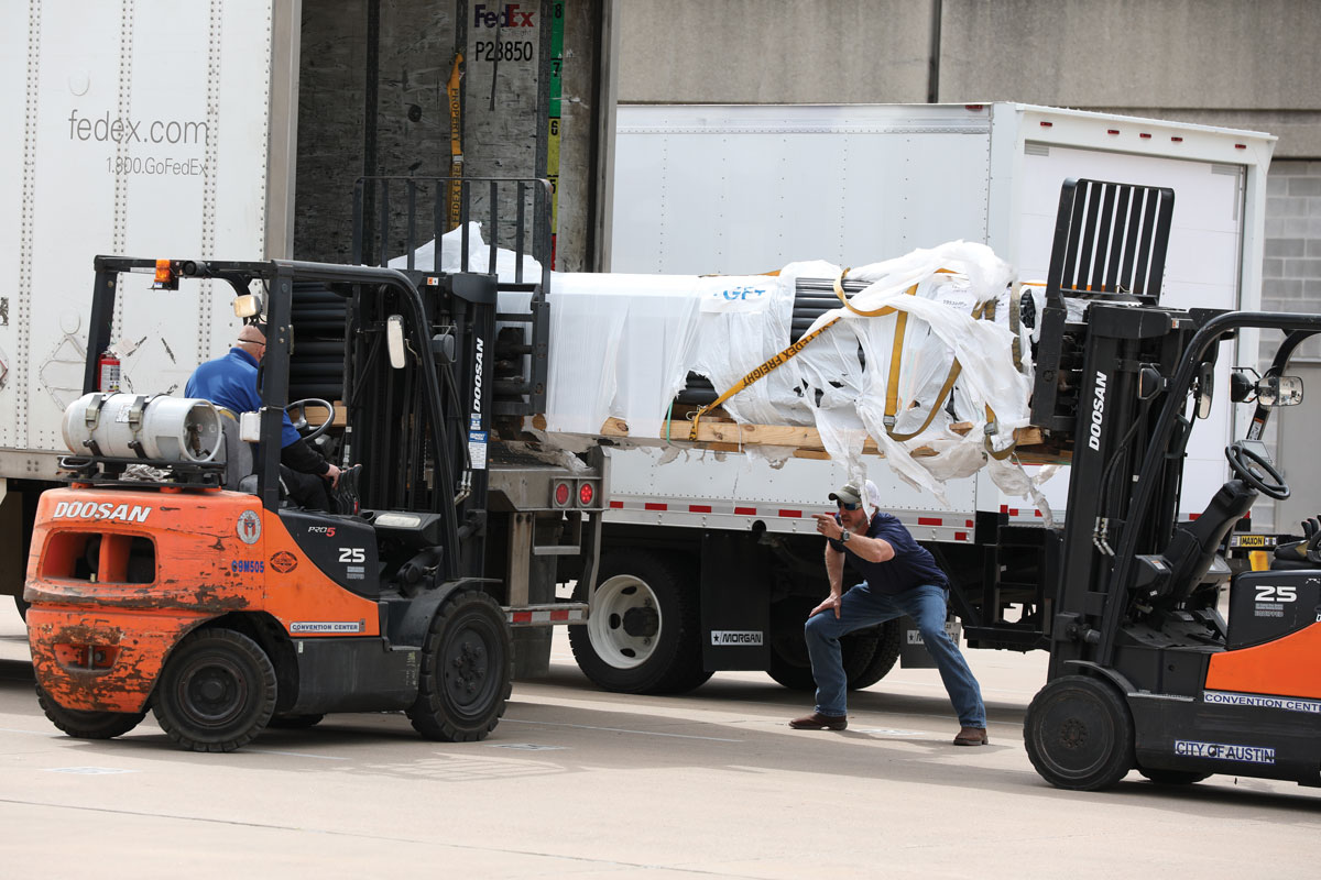 Water Mission employees unloading GF piping products for disaster victims in Texas