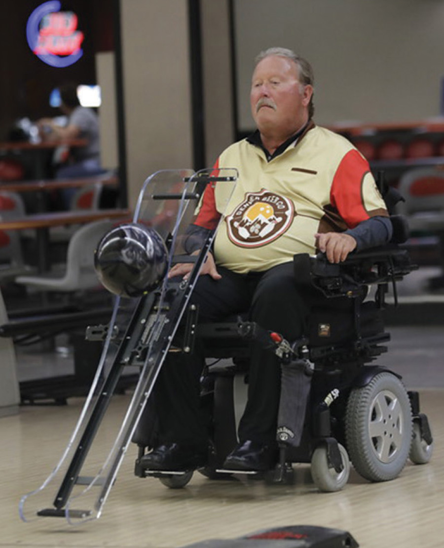 Man on wheelchairs bowl