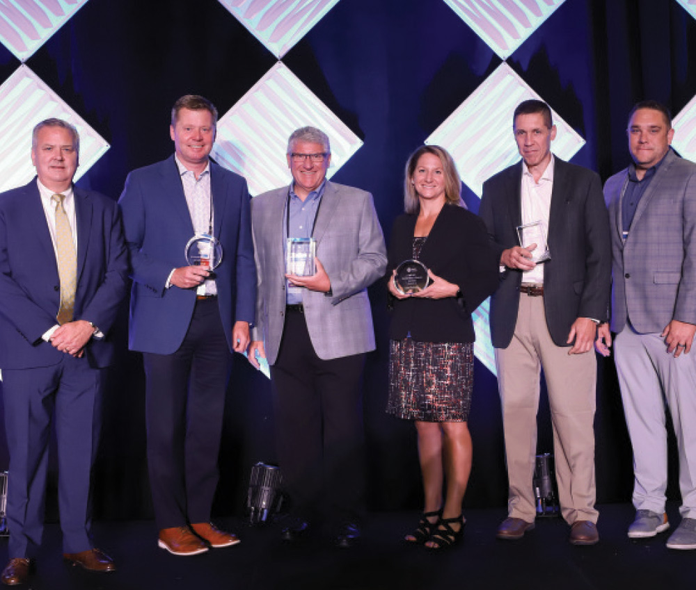 Craig Saunders presents the Gold Level Environmental Excellence Award to Gerry Helbig, Peter DelGado, Jinny Kcehowski, Keith Hechtel and Dallas McLaughlin of Curbell Plastics, Inc.