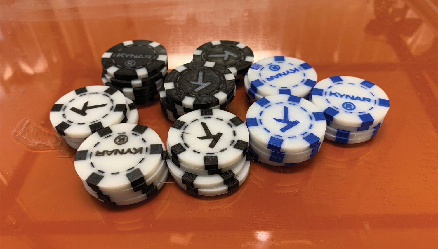 3D printed poker chips, featuring colors black blue and white