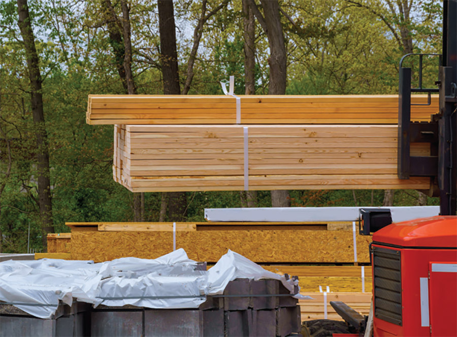 A landscape photograph of high-value lumber protected by HDPE from Liberty Plastics, Inc.