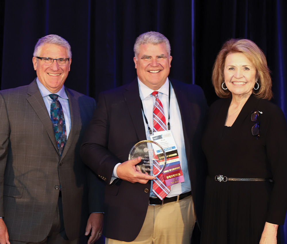 Peter DelGado and Deborah Ragdale prested the the Gold Level Circle of Champions Award to Rick Gough Polymershapes