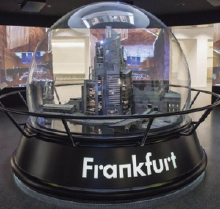 The 705-pound block of ACRYLITE® is home to eight different cityscape displays of Frankfurt, Germany.