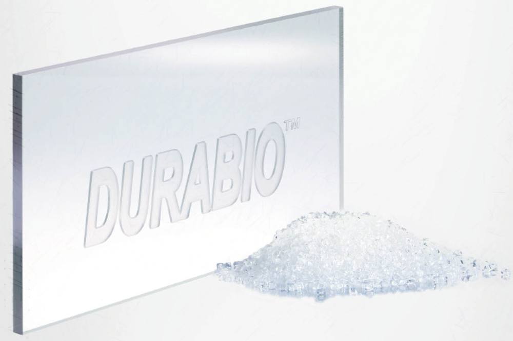 small plastic pieces next to a Durabio logo cut into a larger piece of plastic