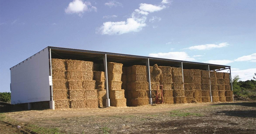 PALRUF Industrial corrugated PVC sheets being used in a livestock feed storage center