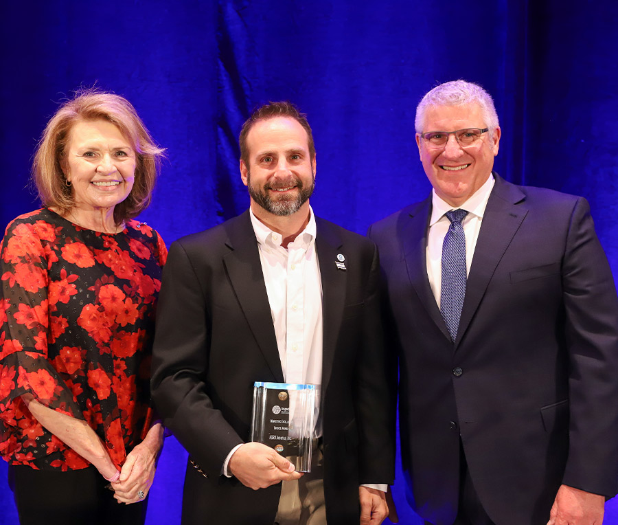 recipient Michael Krauss standing between Deborah Ragsdale and Peter DelGado