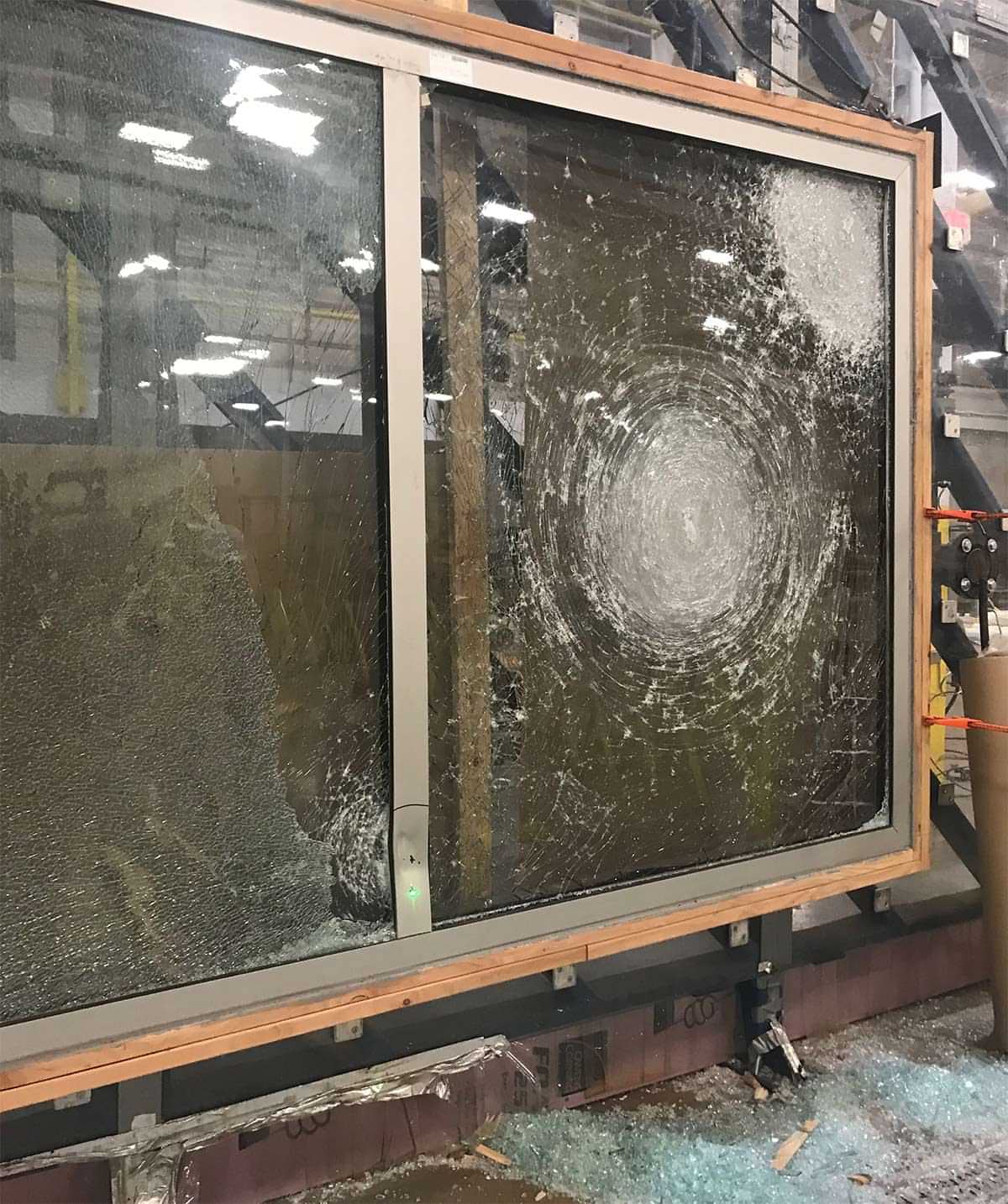shattered window in a lab warehouse setting