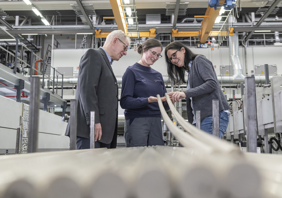 Ensinger staff talking to customers in factory