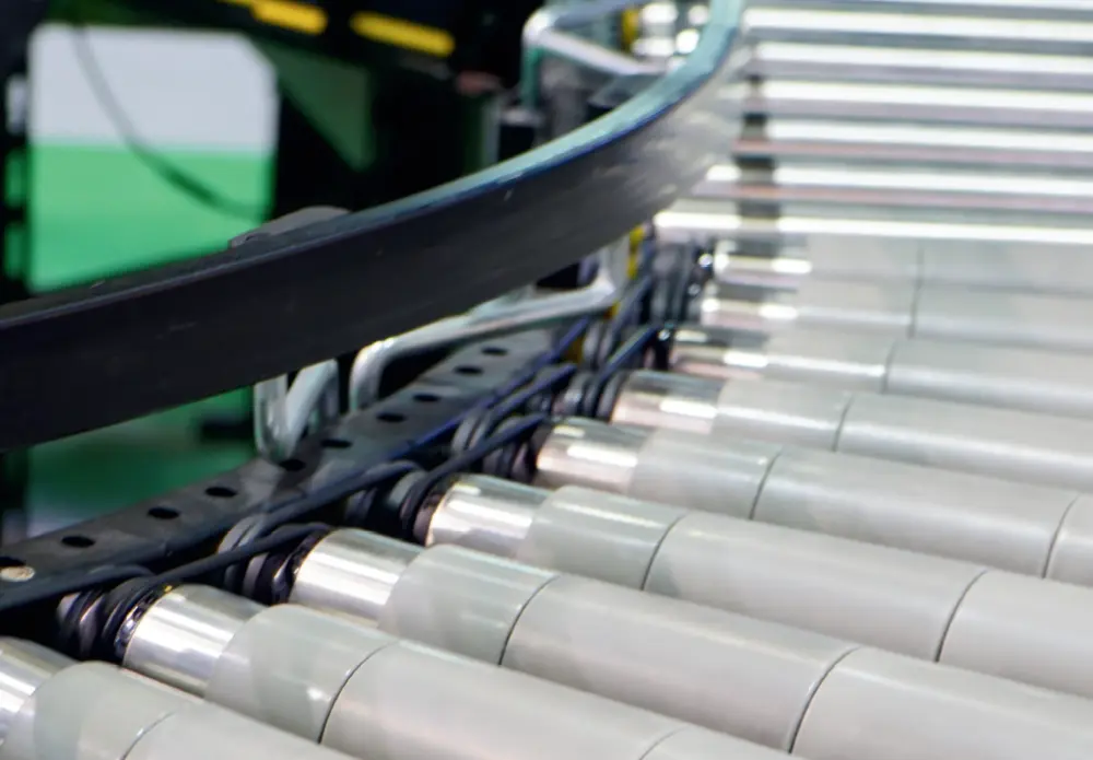 close up of conveyor belt with black guide rails from King Hy-Pact