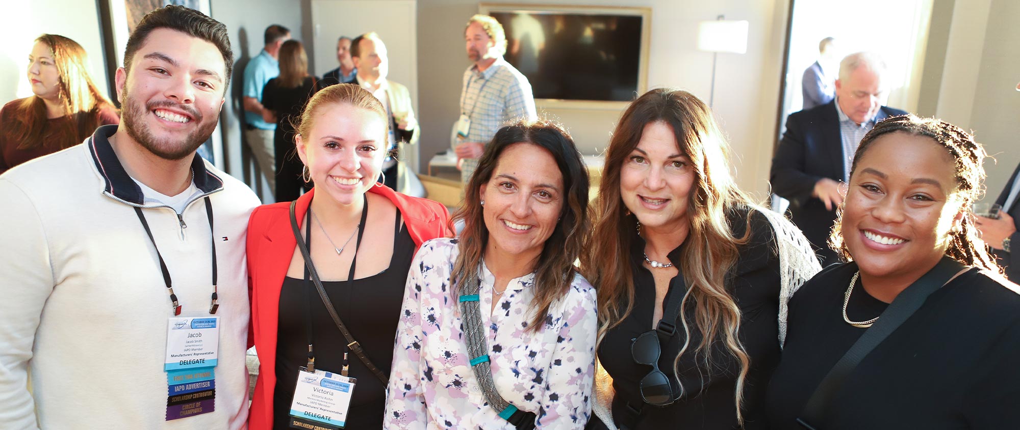 five delegates take a group photo at a convention reception event