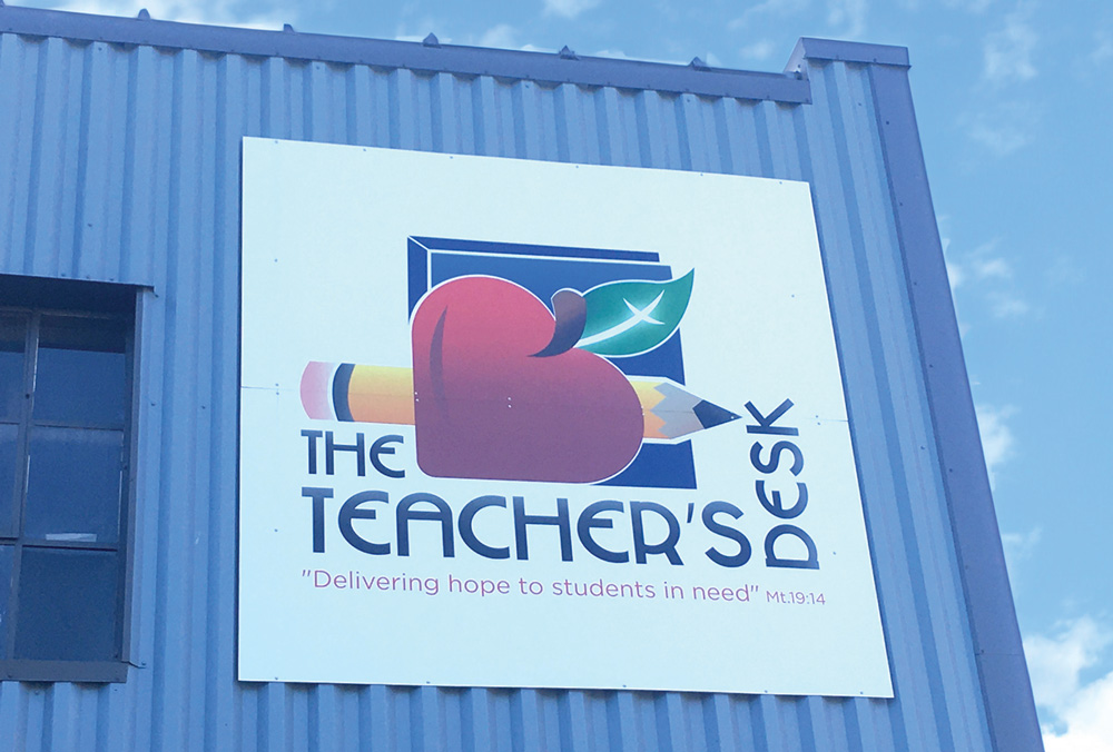 exterior sign for The Teacher’s Desk
