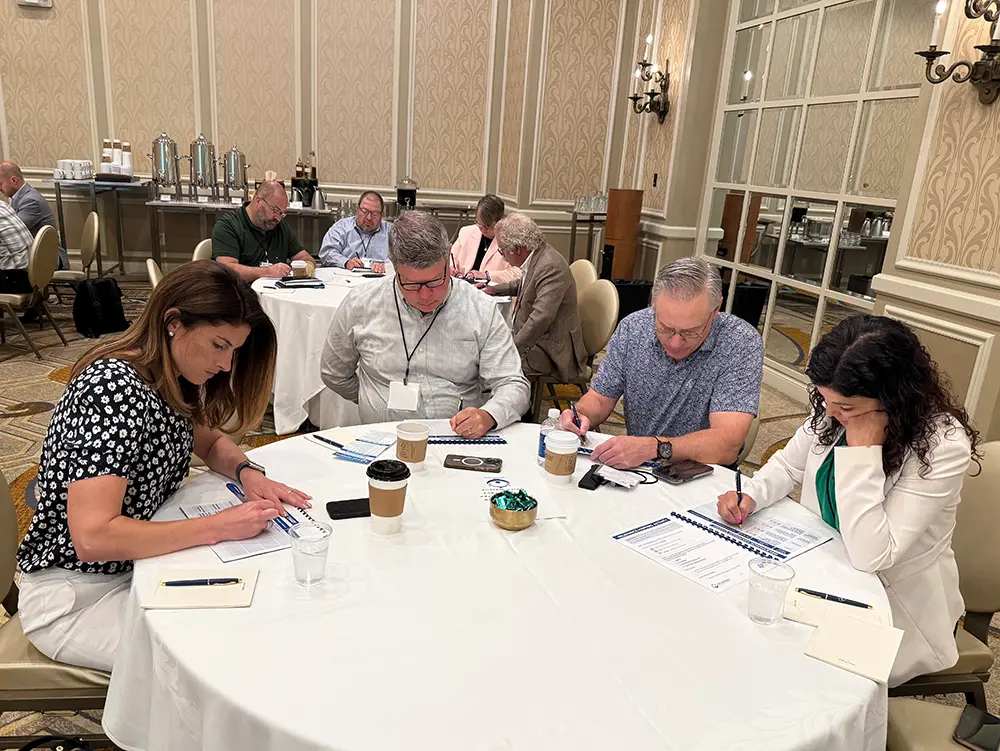  Volunteers from the International Association of Plastics Distribution (IAPD) participate in a workshop.