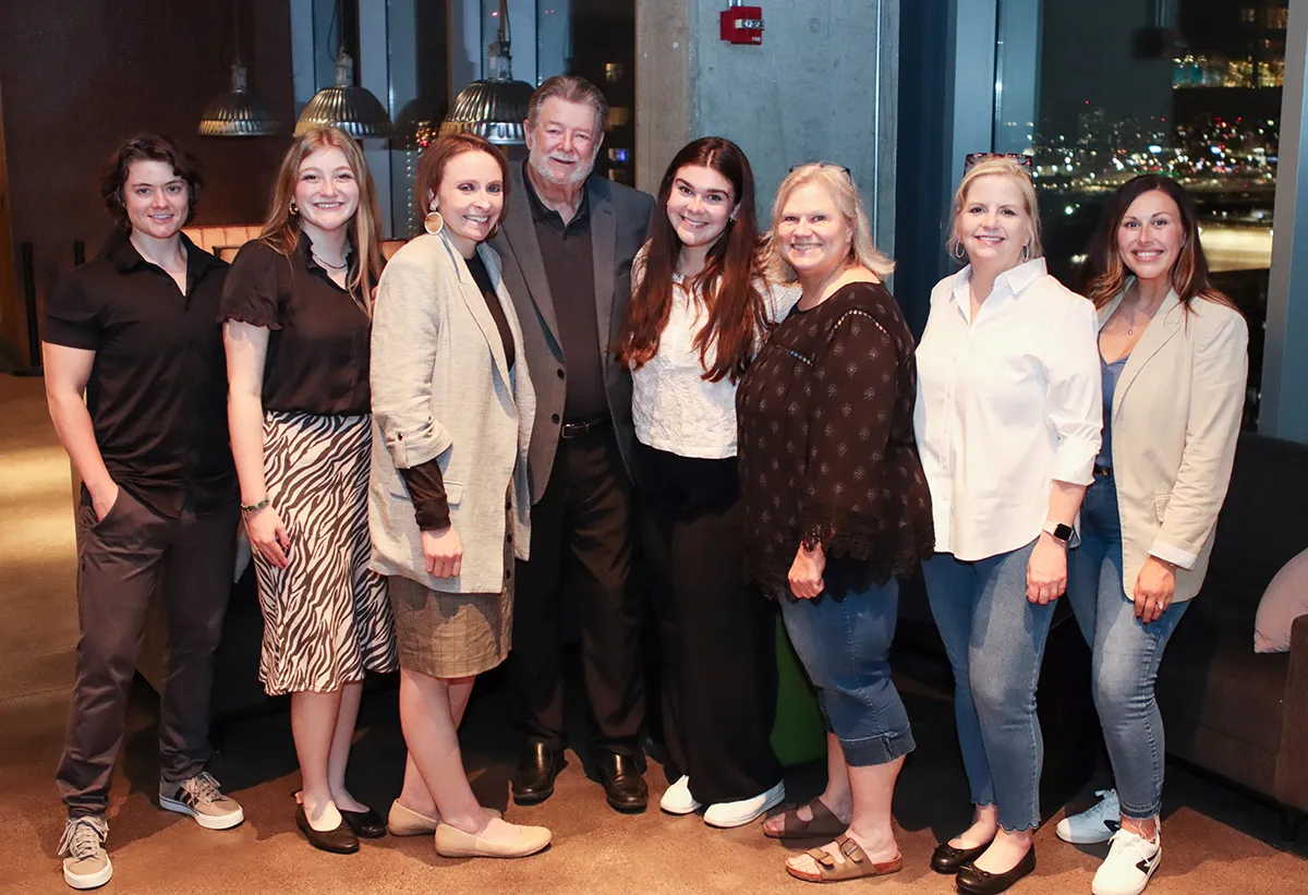 IAPD staff and member Randy Kirkpatrick at the IAPD Annual Convention closing party posing together