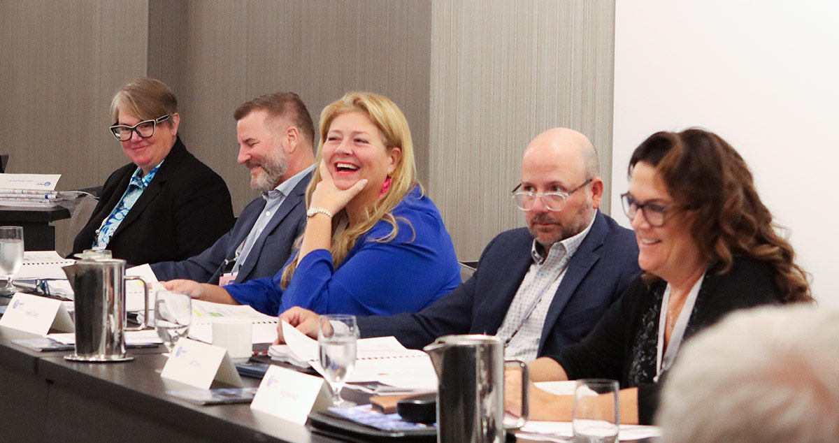 Members of the IAPD Board of Directors sitting at a panel together during the IAPD Annual Convention
