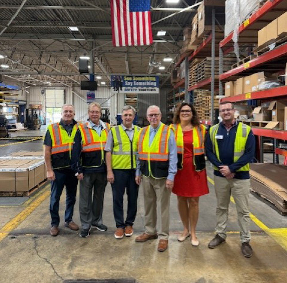 Representative Tim Walberg pictured with Alro Plastics employees