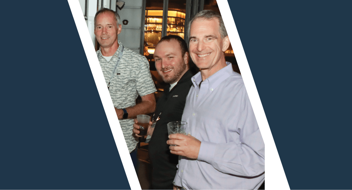 A horizontal graphic with a slanted photo slice against a dark blue background, showing three men smiling with drinks at a networking event.