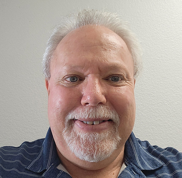 headshot of Lenny Evanson